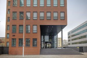 Modern office building at Hiridostraat 3 with a brick facade and glass entrance.
